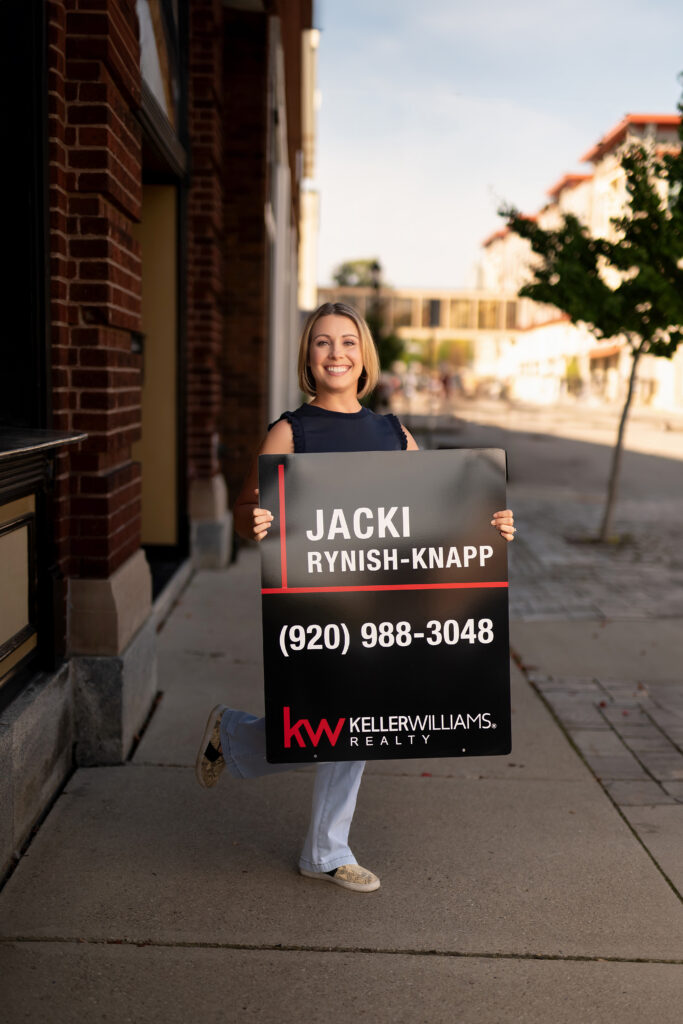 Jacki Rynish-Knapp Real Estate Agent Sign Portrait in Downtown Waukesha WI